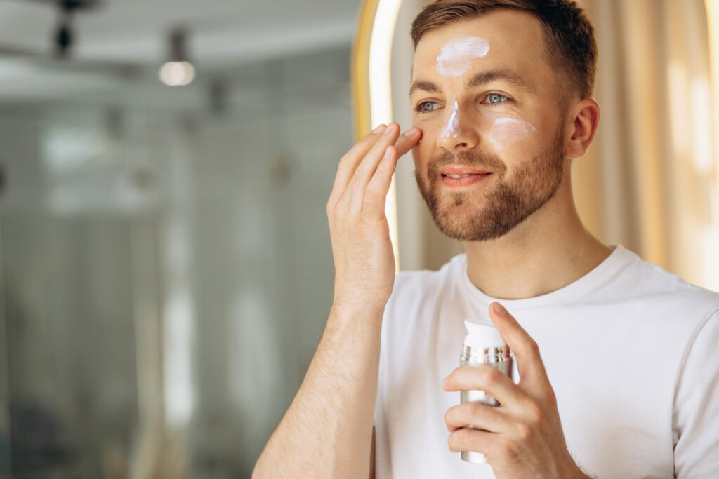 man-applying-face-cream-home